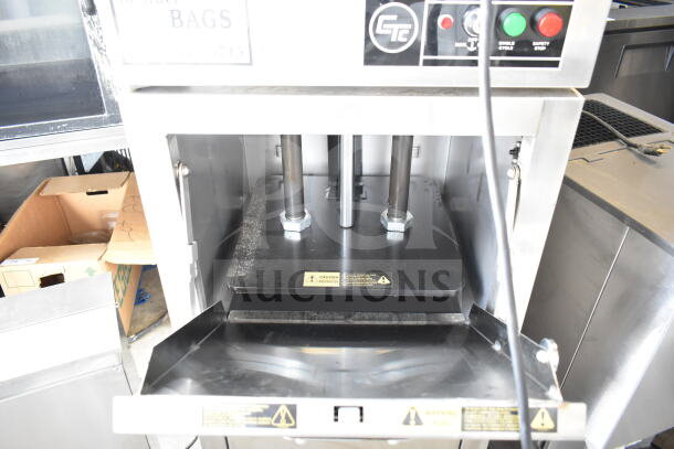 Chicago commercial vertical trash compactor on casters, controls visible, sturdy construction, safety warnings, lightly used.