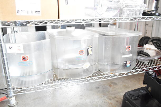 Clear plastic hoppers for drink blending machines on a metal shelf, with visible caution labels and auction tag marked "58."