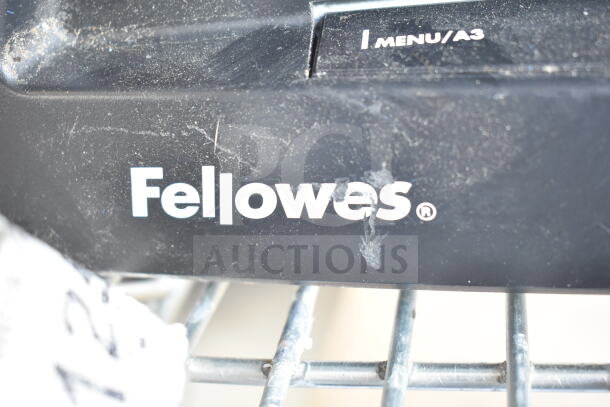 Fellowes Saturn 3i 125 Pouch Laminator, black, visible wear, labeled "Fellowes" and "Menu/A3," suggests user interface.