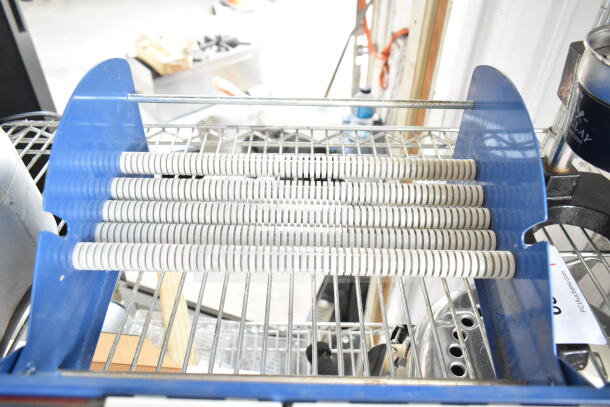Uline Cutter with blue metal frame and multiple white cutting discs, in good condition, on a wire rack shelf.