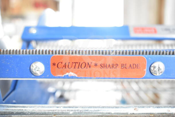 Uline Cutter with sharp blade warning, blue metal frame, visible caution label. Good condition, ideal for packaging tasks.