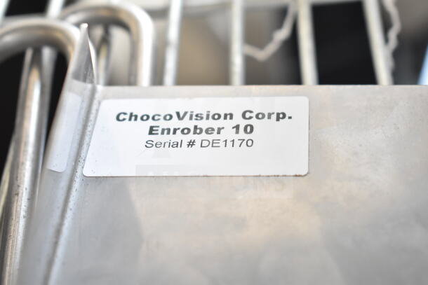 ChocoVision Enrober 10, serial #DE1170, shown on a metal surface with a company label attached.