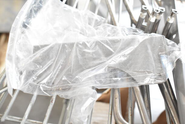 5 various items including a ChocoVision enrober, encased in plastic wrap, metal rods visible, suggests complete set.