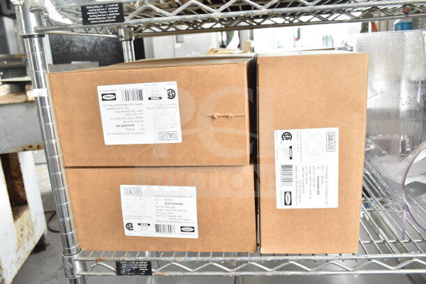 Boxes containing DualLite LED Emergency Light, model EVHC6DP-WM, on a shelf. Labels show specifications and compliance marks.