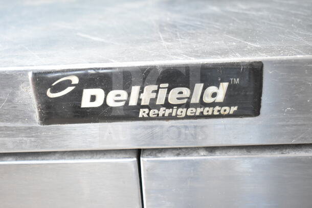 Delfield commercial prep table with bain marie, mega top, 4 drawers, over shelf; 115 volts, 1 phase, used condition.