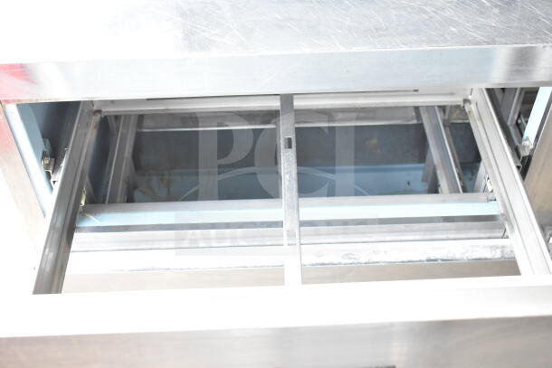 Delfield commercial sandwich prep table with mega top, four drawers, and over shelf, 115 volts, 1 phase, stainless steel.