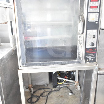 Henny Penny SCR-6 electric rotisserie oven on casters, used, featuring control panel and glass door, visible wear.