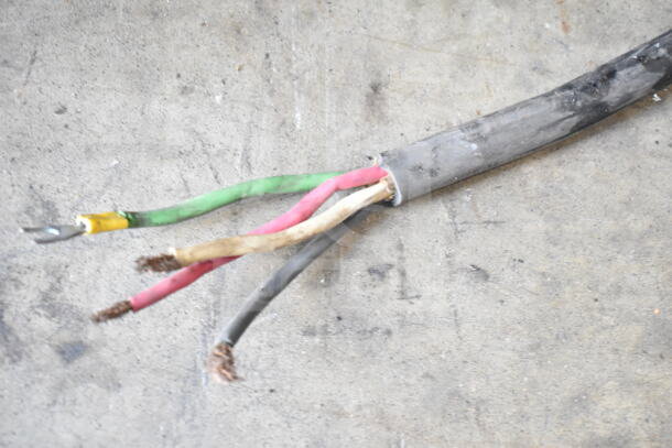 A disconnected power cable with exposed wires, showing wear, for the Henny Penny SCR-6 rotisserie oven.