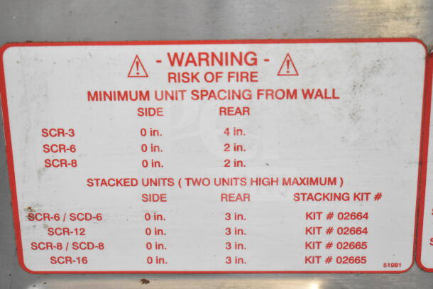 Henny Penny SCR-6 commercial electric rotisserie oven with warning label detailing minimum unit spacing from wall.