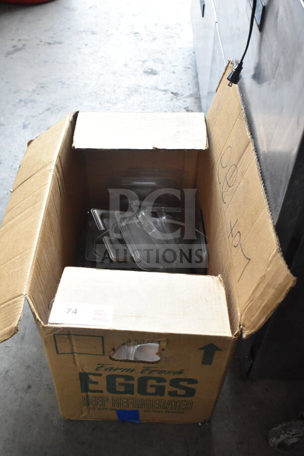 Cardboard box containing 34 various items including drop-in bin lids. Visible label indicates "Farm Fresh Eggs."