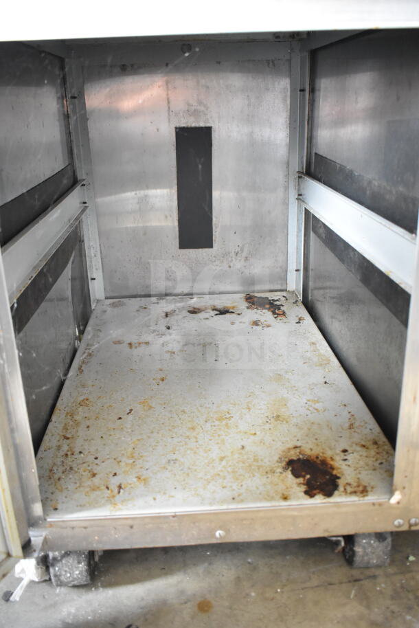 Taylor C709-33 single flavor ice cream machine interior. Visible wear and rust. 208-230V, 3 Phase, on casters.