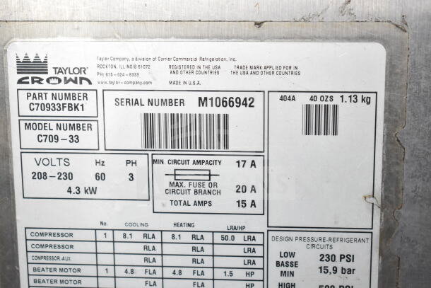 Taylor C709-33 soft serve machine label showing model, serial number M1066942, 208-230V, 3 phase, 4.3kW power.