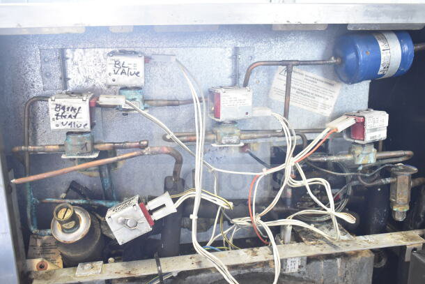 Taylor C709-33 soft serve machine's internal wiring and components, showing valves and labels. 208-230V, 3-phase.