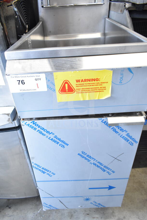 2022 KUT50FRN50SNG commercial gas fryer, new condition, stainless steel, protective film with warning label.