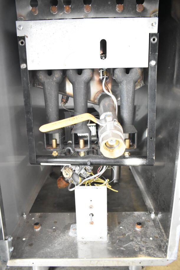2022 KUT50FRN50SNG commercial floor style natural gas deep fat fryer, showing internal gas connections and durable build.