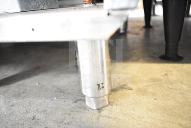 2022 KUT50FRN50SNG commercial fryer leg detail, natural gas powered, stainless steel, showing number marking.