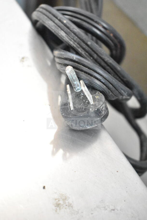 Power plug of Ice-O-Matic ICEU220HA3 Ice Machine. 115V, 1 Phase. Coiled black cord, slight wear on plug.