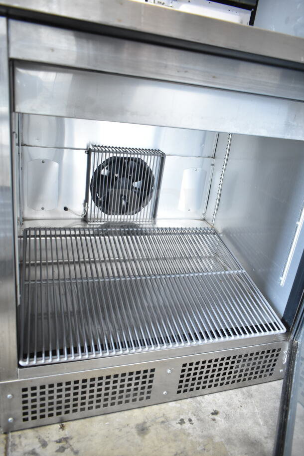 2017 True TFP-32-12M sandwich salad prep table without lid, stainless steel, 115V, 1 phase, interior view.