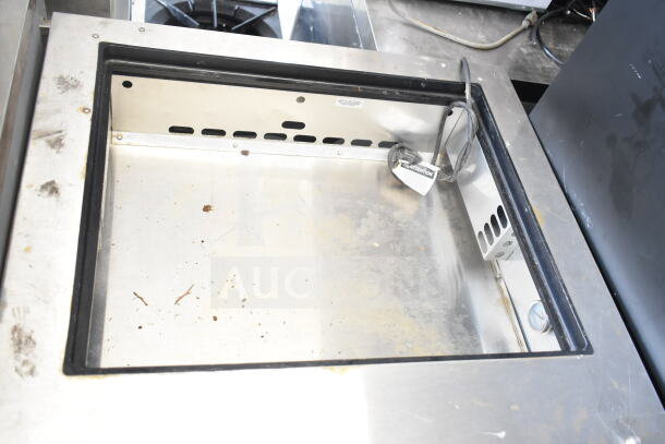 2017 True TFP-32-12M prep table, stainless steel, missing lid, 115V, 1 phase, interior wear visible, power cord attached.