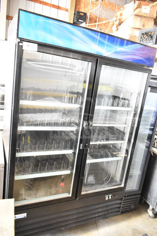 2025 Avantco 178GDC49HCB 2-door reach-in cooler merchandiser, glass doors, 115V, shows interior shelving, good condition.