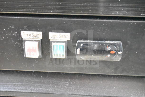 Close-up of Avantco 178GDC49HCB cooler panel showing power and light switches. 115 volts, 1 phase.