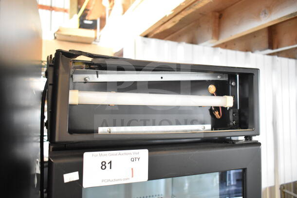 IDW G-11-C33EB commercial cooler with single door. 115 Volts, 1 Phase. Auction label "81" visible. Upper panel detail shown.