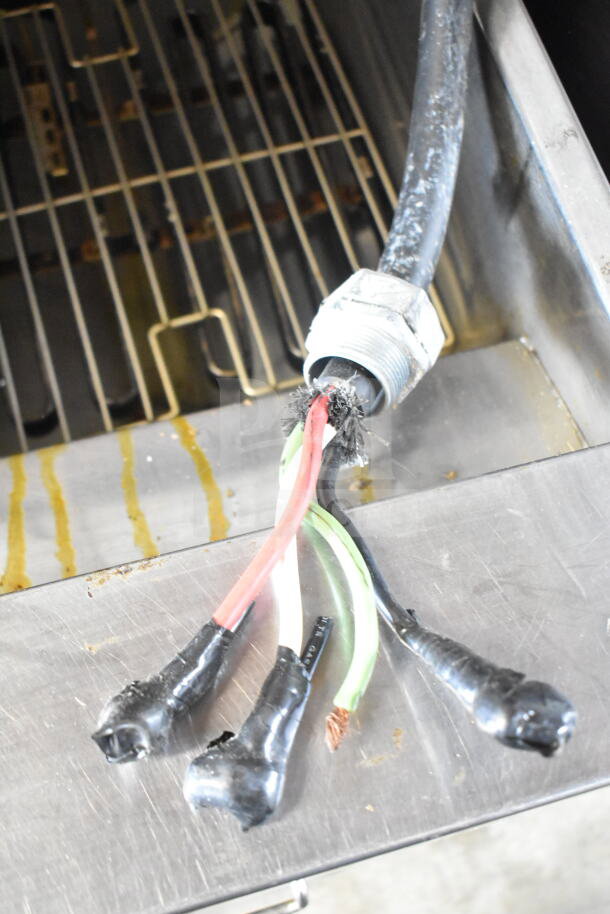 Frymaster FPH214BLSC 2-bay deep fryer, exposed power cord damage, visible wiring in metal compartment.