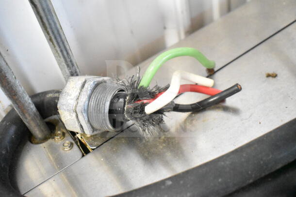Frayed electrical wiring on Frymaster FPH214BLSC fryer. Condition shows wear, requiring attention for safe operation.