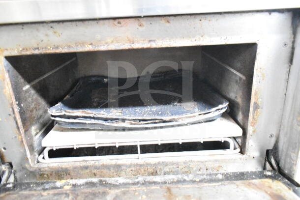2 Turbochef NGC rapid cook ovens, electric, 208/240V, 1 phase, worn interior with trays shown, commercial use.