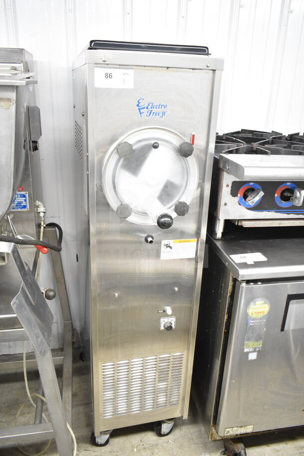 Electro Freeze 876-234 commercial frozen beverage machine, stainless steel, 115V, 1 phase, on casters, visible logo and controls.