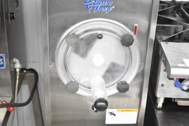 Electro Freeze 876-234 commercial frozen beverage machine, stainless steel, on casters, 115 volts, 1 phase, good condition.