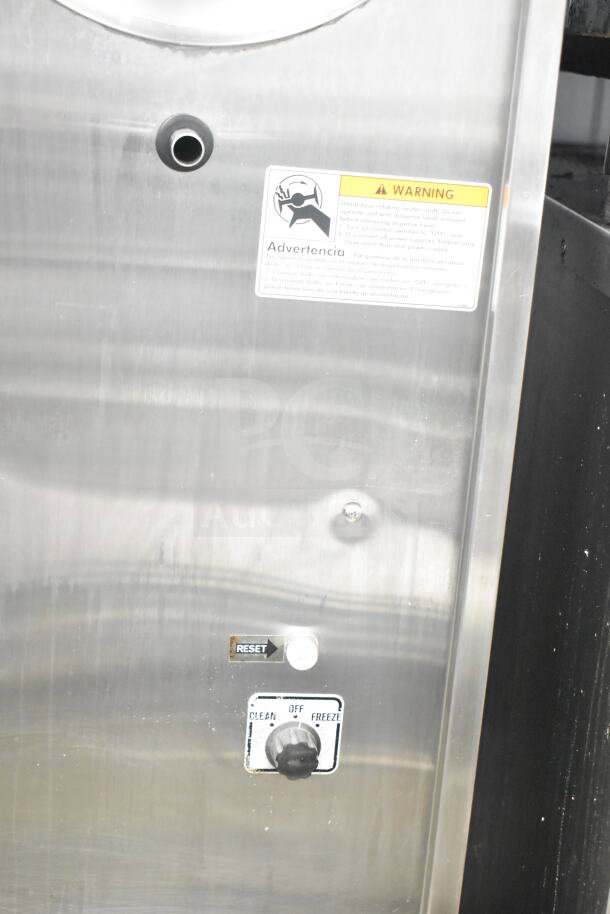 Electro Freeze 876-234 commercial frozen beverage machine on casters, 115V, 1 phase. Visible control dial and reset button.