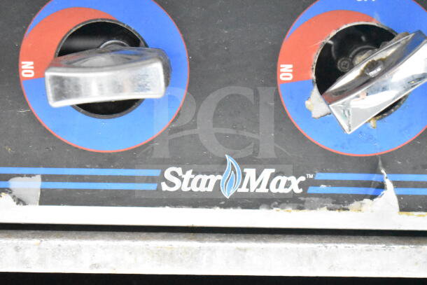 Star Max Commercial 6 Burner Gas Range, showing control knobs marked "On," with visible wear on the front panel.