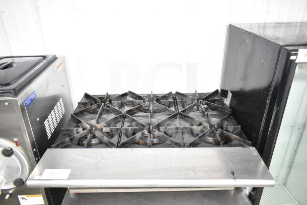 Star Max Commercial Gas 6 Burner Range, countertop model, metal construction, used condition, visible surface wear.