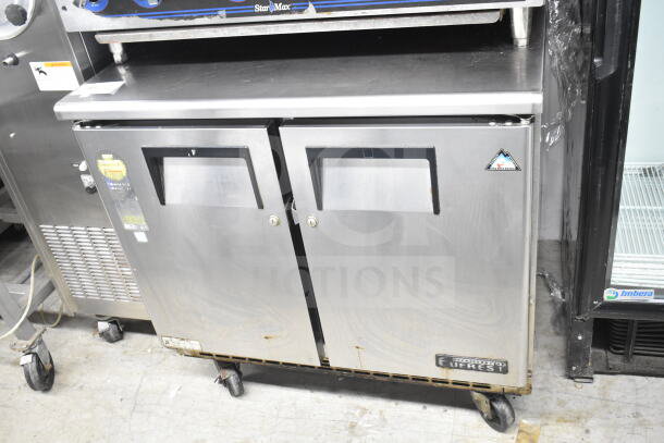 Everest ETBSF2 Commercial 2 Door Undercounter Freezer, stainless steel, 115V, 1 Phase, good condition, visible brand logo.