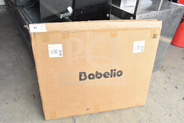Babelio Baby Gate in original packaging, unopened box with manufacturer logo visible, shows label and shipping details.