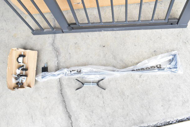 Babelio Baby Gate, metal construction, includes installation hardware in box, new condition, labeled packaging visible.