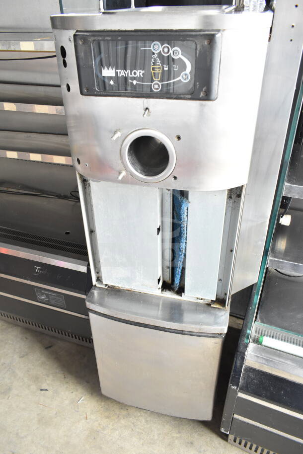 Taylor C709-33 commercial soft serve machine, stainless steel, single flavor, air-cooled, 208-230V, on casters.