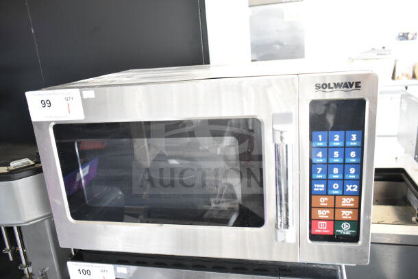 2022 Solwave 180MW112T commercial microwave, stainless steel, 120V, digital keypad, excellent condition, auction label visible.