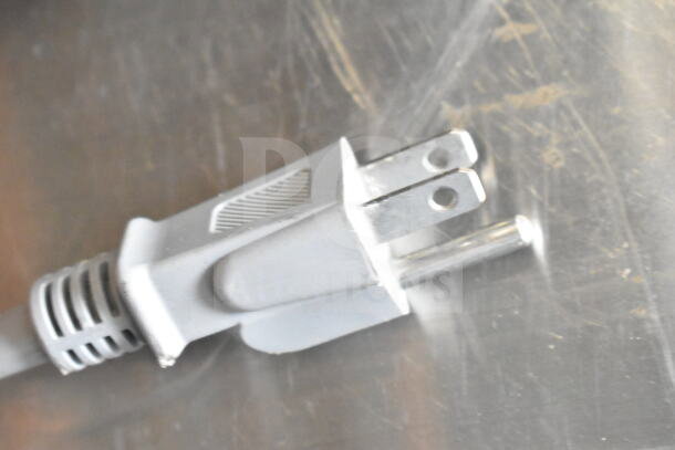 Close-up of the plug for a 2024 Toshiba EM131A5C-BS Commercial Countertop Microwave Oven, 120 Volts, 1 Phase.