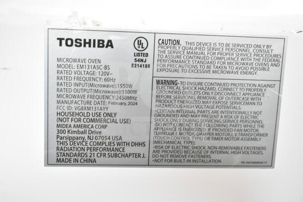 2024 Toshiba EM131A5C-BS microwave label showing model, voltage, frequency, and manufacturing details for household use.