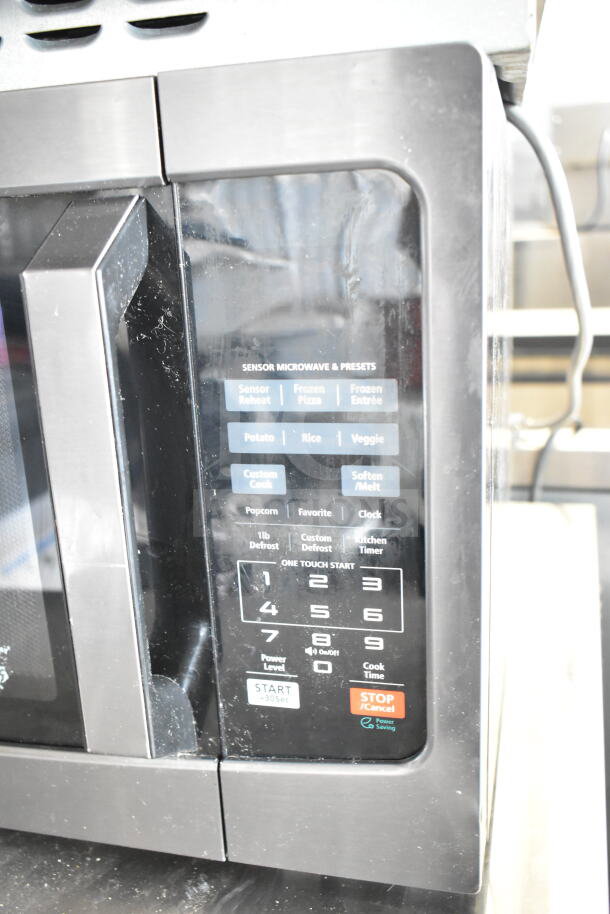 2024 Toshiba EM131A5C-BS Commercial Microwave, 120V, features sensor presets, keypad controls, black stainless finish.