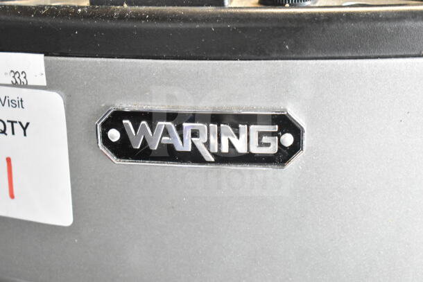 Waring WDM360 3 Head Drink Mixing Machine, 120V, commercial use, good condition, nameplate with Waring logo visible.