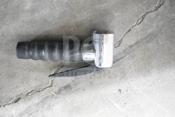 Handheld tool with chrome and black grip, likely a tire chuck for inflating tires. Shows wear, but functional.