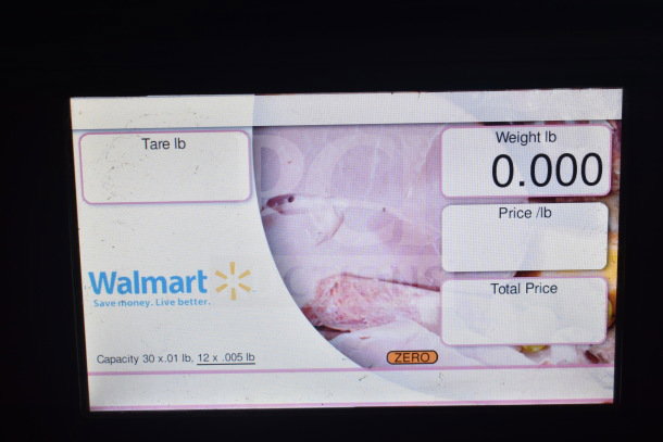 2017 Hobart HTi-7LH26 commercial scale display showing weight at zero. "Walmart" and capacity details visible.