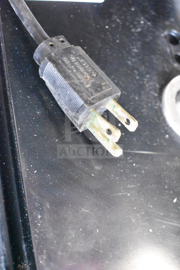 Close-up image of a power plug for the 2017 Hobart HTi-7LH26 commercial food portioning scale.