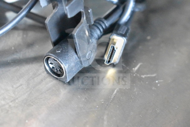 Cables and connectors on a metal surface, related to the Hobart HTi-7LH26 food portioning scale.