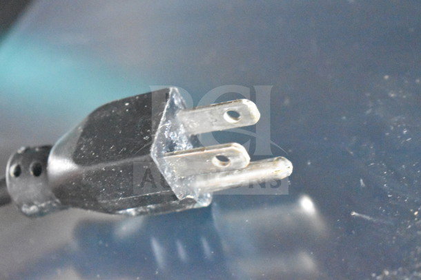Close-up of a black power plug for the 2017 Hobart HTi-7LH26 commercial food portioning scale. Plug for 120/208-240V use.