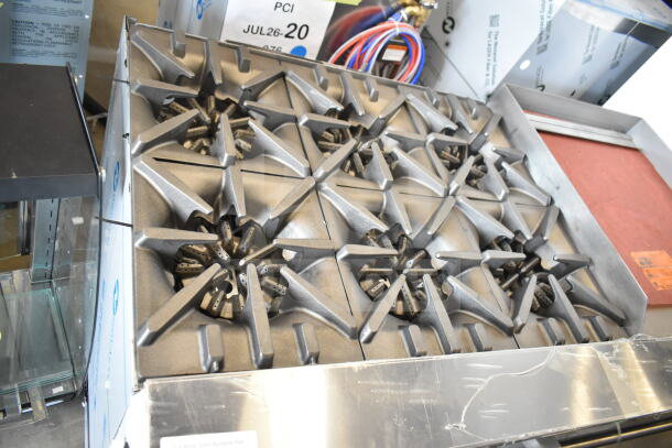 "Garland G60-6G24CC range, new condition, 6 burners, 24-inch griddle, 2 convection ovens, 280,000 BTU, stainless steel."