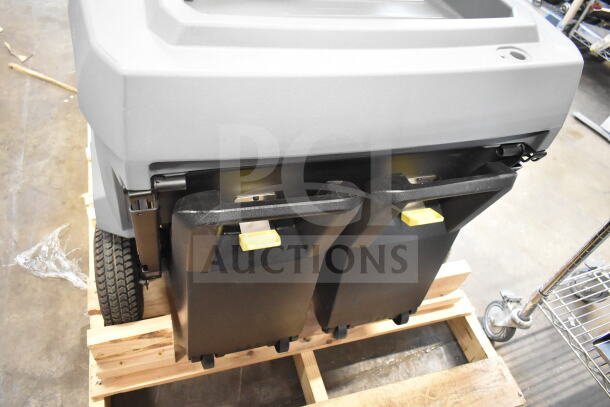 BRAND NEW Karcher KM 85/50 R BP 24" AGM Cordless Ride-On Sweeper, 13.2 Gal, shown on pallet, scratch and dent condition.
